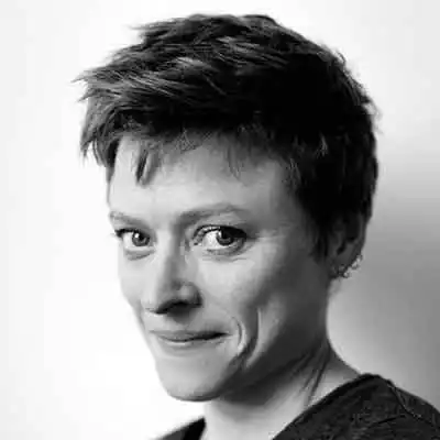 Person with short, styled hair.